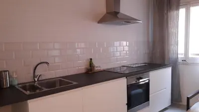 a kitchen with a sink and a stove at BLAU in Masnou