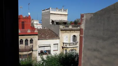 a view of buildings from a window of a building at BLAU in Masnou