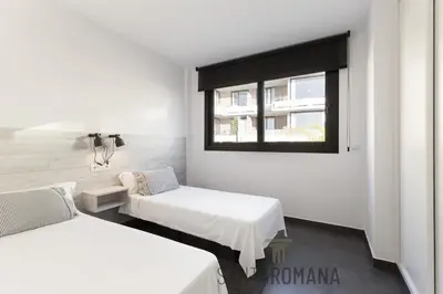 a room with a treadmill in front of a window at Santa Romana Apartments & Suites in Caldes d'Estrac