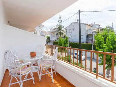 a balcony with a table and chairs and a view of a street at Holiday Home Katy by Interhome in Cunit