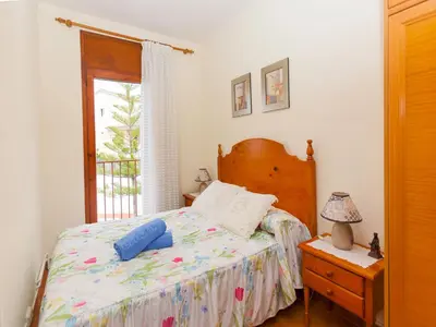 a bedroom with a bed and a window at Holiday Home Katy by Interhome in Cunit