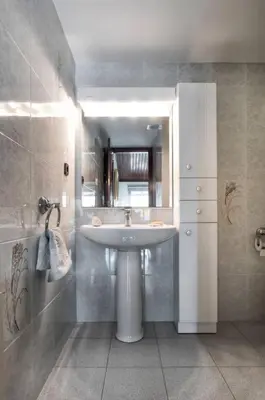a bathroom with a sink and a mirror at Villa Paquita in Calella