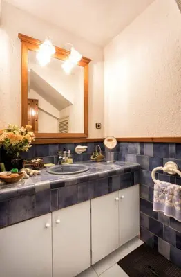 a bathroom with a sink and a mirror at Villa Paquita in Calella