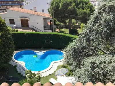 an overhead view of a swimming pool in a yard at Villa Paquita in Calella