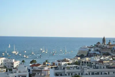 a view of a city with boats in the water at APARTAMENTO MARINERO, Vistas impresionantes. in Sitges