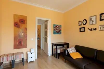 a living room with a couch and a table at Housalia Guell & Gracia in Barcelona