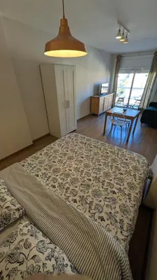 a bedroom with a large bed in a room at Arena Gold Euroviajeros apartaments in Pineda de Mar