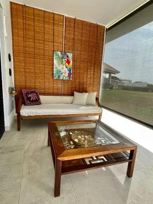 a living room with a couch and a table at Palm Maresme - Suite with bathroom and terrasse with ocean views in a private villa in Vilassar de Dalt