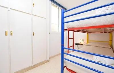 a bunk bed in a room with a bunk bed in a room at Apartamento Pineda in Pineda de Mar