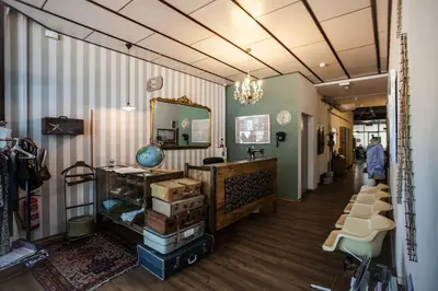 a store with a hallway with a mirror and some boxes at Pars Tailor's Hostel in Barcelona
