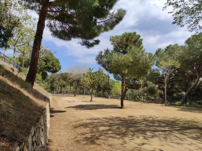 a park with trees and a dirt road at Camping Roca Grossa in Calella