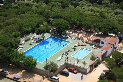 an overhead view of a swimming pool in a park at Camping Roca Grossa in Calella