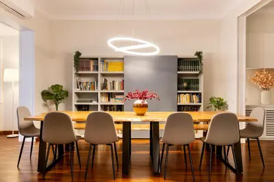a dining room with a wooden table and chairs at Large & beautiful apartment 4min from Passeig de Gràcia in Barcelona