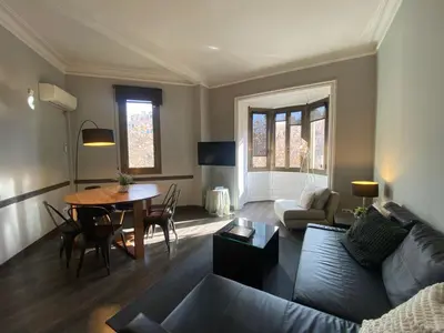 a living room with a couch and a table at 555 Apartments BCN in Barcelona