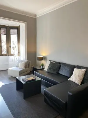 a living room with a couch and a coffee table at 555 Apartments BCN in Barcelona