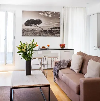 a living room with a couch and a table at Durlet Beach Apartments in Barcelona