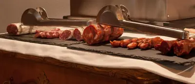 a tray of meat on a counter with bacon at Mihlton Barcelona Boutique B&B in Barcelona