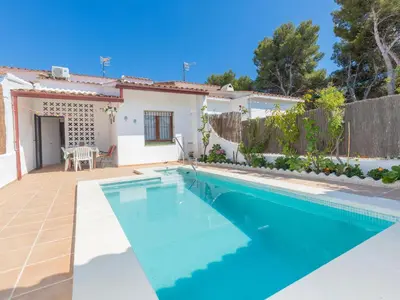 a swimming pool in front of a house at Holiday Home Remedios by Interhome in Cunit