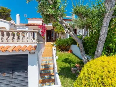 a house with a gate and a yard at Holiday Home Remedios by Interhome in Cunit
