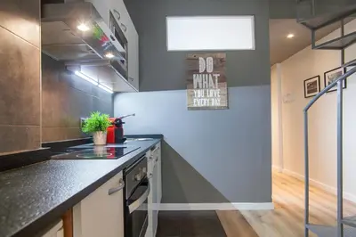 a kitchen with a stove and a counter top at Tendency Apartments 8 in Barcelona