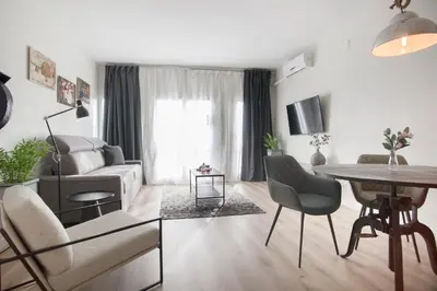 a living room with a couch and a table at Tendency Apartments 8 in Barcelona
