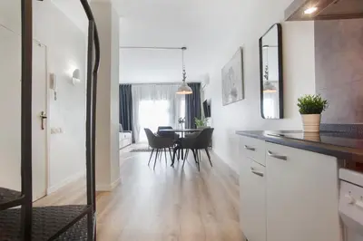 a kitchen and dining room with a dining table at Tendency Apartments 8 in Barcelona