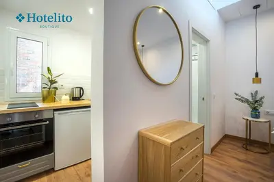 a kitchen with a mirror on the wall at Hotelito Boutique Badalona Mar in Badalona