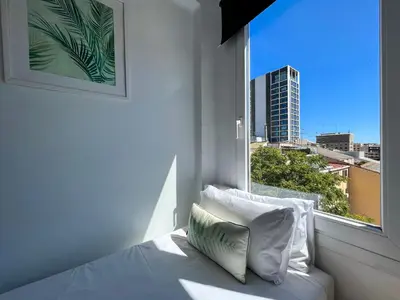 a bedroom with a bed and a window with a view at Stay U-nique Apartments Sèneca in Barcelona