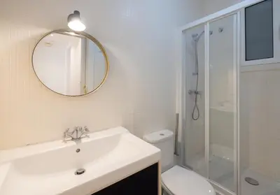 a white bathroom with a sink and a shower at Stay U-nique Apartments Floridablanca in Barcelona