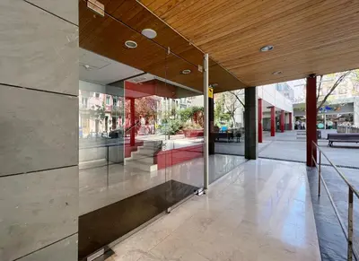 a lobby of a building with glass walls at Stay U-nique Apartments Degà Bahí in Barcelona