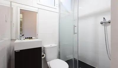 a bathroom with a toilet and a sink and a shower at Stay U-nique Apartments Casanova in Barcelona