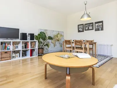 a living room with a table and a tv at Apartment Vila Olimpica Sant Marti by Interhome in Barcelona