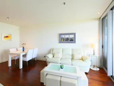 a living room with a white couch and a table at Apartment Diagonal Mar by Interhome in Barcelona