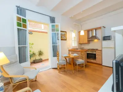 a kitchen and dining room with a table and chairs at Apartment Gracia Torrijos by Interhome in Barcelona
