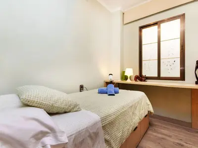 a bedroom with two beds and a window at Apartment Sants-Montjuic Rambla Badal by Interhome in Barcelona