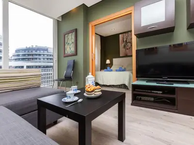 a living room with a large flat screen tv at Apartment Sants-Montjuic Rambla Badal by Interhome in Barcelona