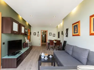 a living room with a couch and a table at Apartment Sants-Montjuic Rambla Badal by Interhome in Barcelona