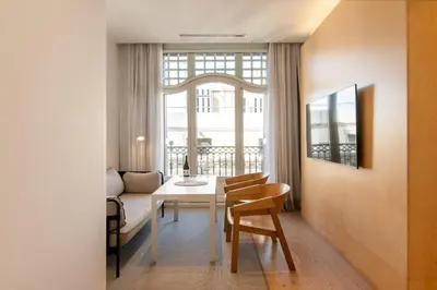 a bathroom with a toilet and a glass shower at Gòtic by The 5ve Soul in Barcelona