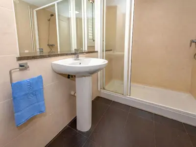 a bathroom with a sink and a shower at Apartment Blaumar by Interhome in Sant Andreu de Llavaneres