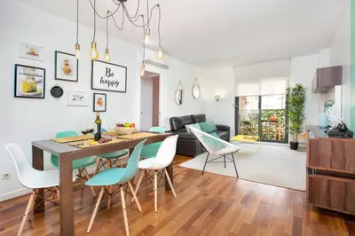 a living room and dining room with a table and chairs at Stay U-nique Apartments Ricart in Barcelona