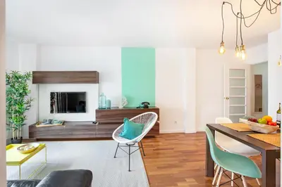 a living room with a table and chairs at Stay U-nique Apartments Ricart in Barcelona