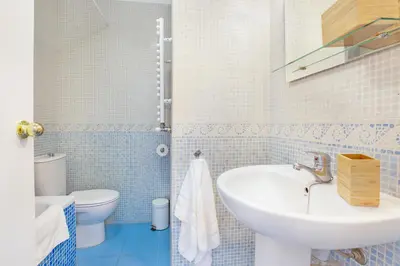 a bathroom with a sink and a toilet at Stay U-nique Apartments Ricart in Barcelona