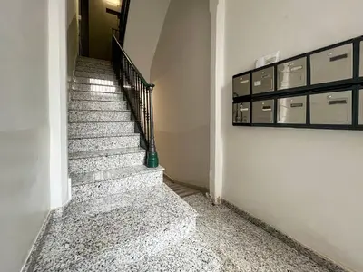 a staircase in a house with a green vase at Stay U-nique Apartments Fontrodona in Barcelona
