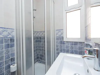 a bathroom with a sink and a shower at Apartment Eixample Dret Sagrada Familia by Interhome in Barcelona