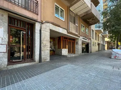 an empty street in front of a building at Stay U-nique Apartments Sardenya II in Barcelona