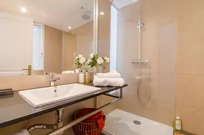 a bathroom with a sink and a shower at BCN Apartments 41 in Barcelona