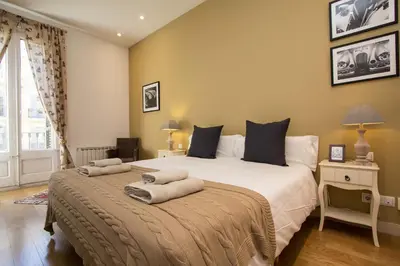 a bedroom with a large bed with two pillows on it at BCN Apartments 41 in Barcelona