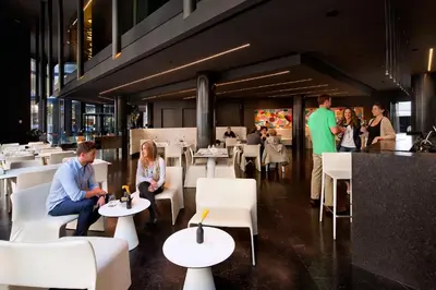 a group of people sitting in a restaurant at Olivia Balmes Hotel in Barcelona