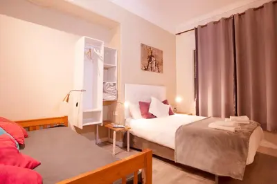 a bedroom with two beds and a window at Wow Hostel Barcelona in Barcelona