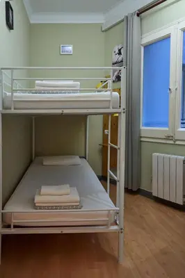 a bunk bed in a room with a window at Wow Hostel Barcelona in Barcelona
